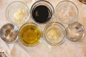 Ingredients for the balsamic vinaigrette pictured in prep bowls