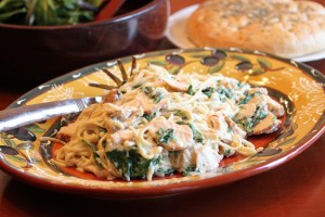 family style platter of chicken Florentine pasta