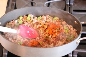 Spanish rice in process cooking on the stove top