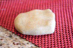 Dough flattened out before putting through the pasta maker