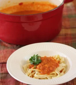 Finished pasta served with tomato sauce