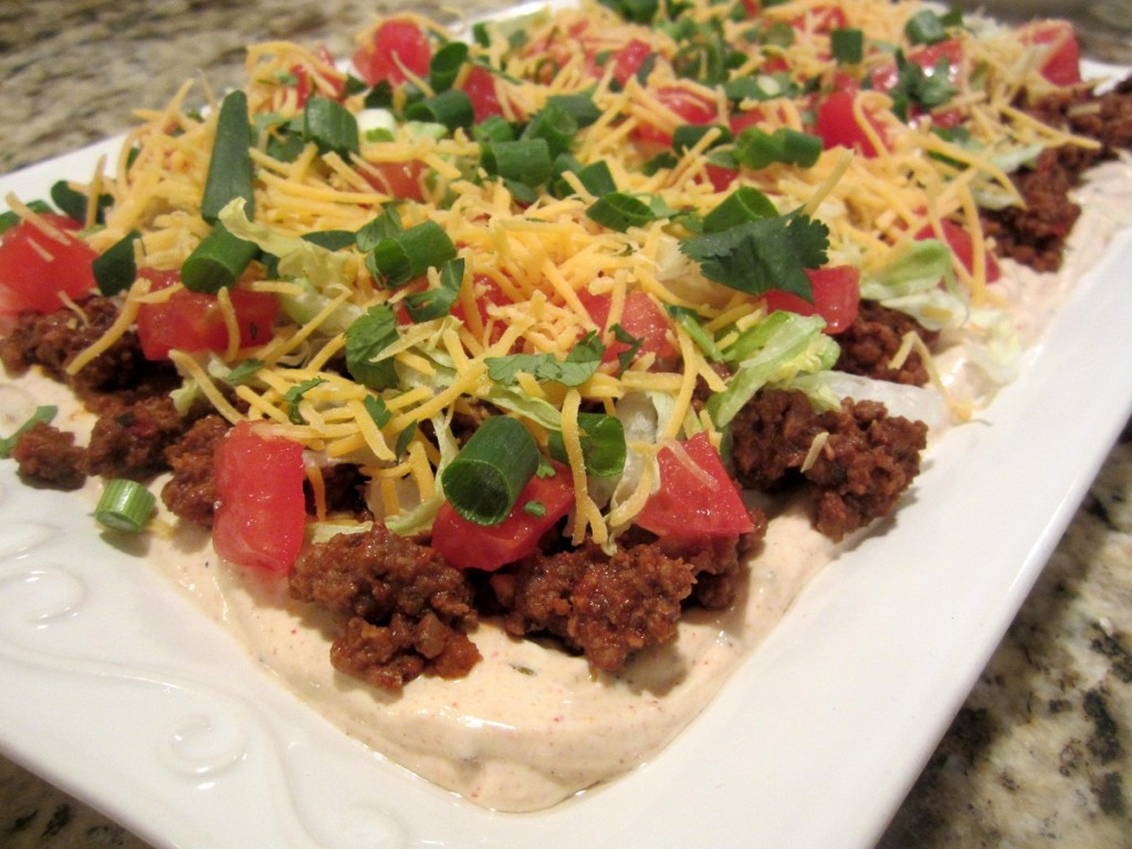 Taco Dip on a platter ready to serve.