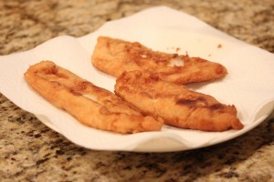 Fish Fillets drain on paper towels after frying