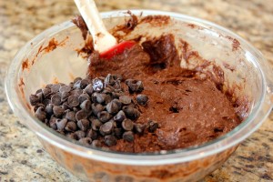 Mixing the chocolate chips into the cake mix/banana mixture