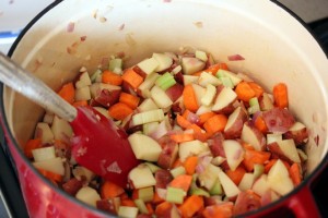 Vegetables sautéing in a dutch oven