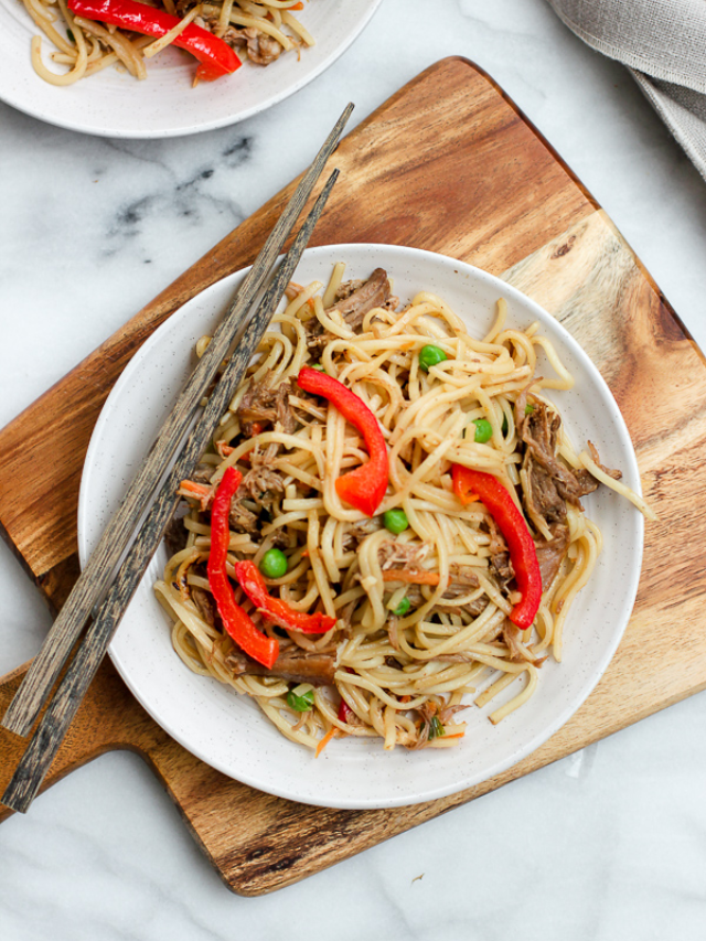 Pork lo mein plated with chop sticks